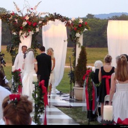 Summer Wedding Chuppah | White Paneling Linen and Red Roses