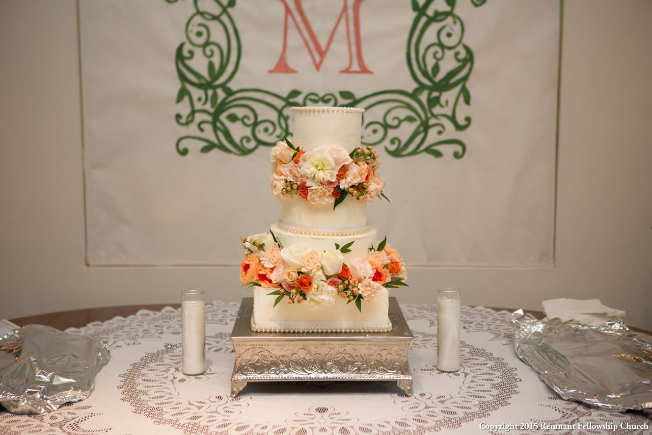 Summer Wedding Cake | Tiered White Wedding Cake with Coral and Peach Flower Accents