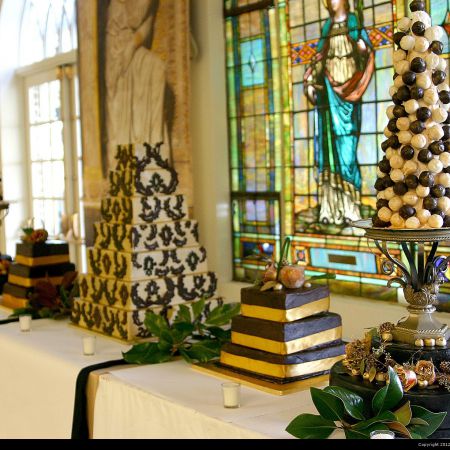 Powers Wedding - Cake Table - Remnant Fellowship Fall Formal Seven-Tiered Wedding Cake | Gold with Olive Wreath Accents