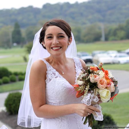 Fall September Bride | Lace Wedding Dress. White and Orange Roses Bouquet