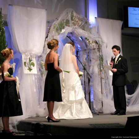 Davis/Copeland Covenant Wedding Spring Wedding Chuppah | Metal Traditional Shaped Chuppah with Greenery, Tule Fabric Covered