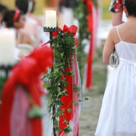 Red Summer Aisle Decorations with Candles and Hanging Vines