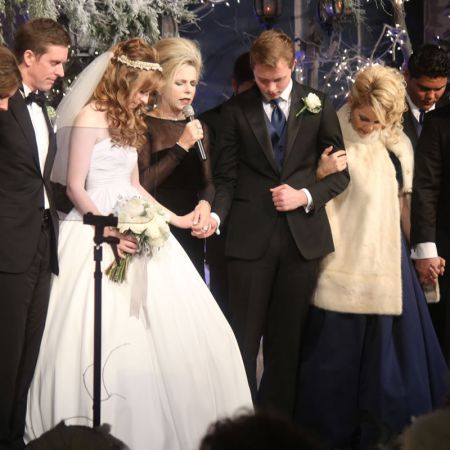 Formal Winter Wedding Color Inspiration | Black and White with hints of Silver | Bride and Groom in Prayer