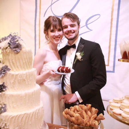 VanZante/Wheeler Covenant Wedding VanZante Wheeler Remnant Wedding White Wedding Cake with Buttercream frosting designs and purple florals by the Remnant Fellowship Cake Committee