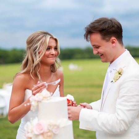 Hahn/Snider Covenant Wedding Hahn and Snider Covenant Wedding Cake Cutting White cake with Floral details by the Remnant Fellowship Cake Committee