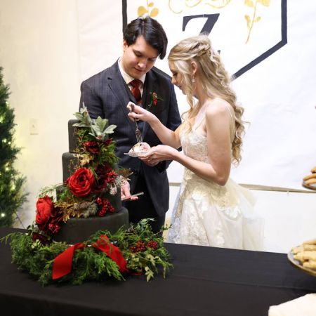 Flahaven/Sanchez Covenant Wedding Flahaven/Sanchez Remnant Fellowship Covenant Wedding, Black Winter Wedding Cake with Red and Green Florals