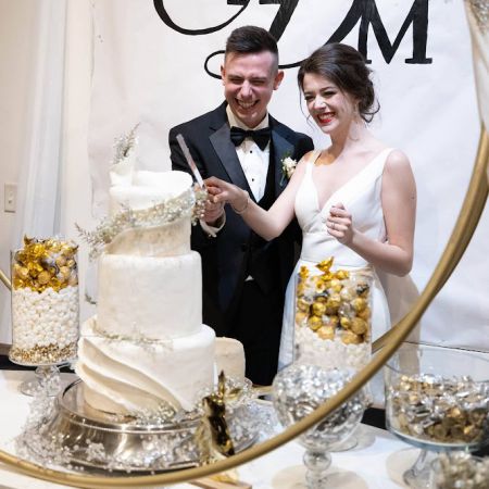 Smith/Dodge Covenant Wedding Smith/Dodge Remnant Wedding-White three tiered wedding cake with intricate frosting designs made by the Remnant Fellowship Cake Committee