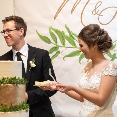 Holmes VanDonsel Remnant Fellowship Covenant Wedding , White and GoldWedding Cake With Greenery