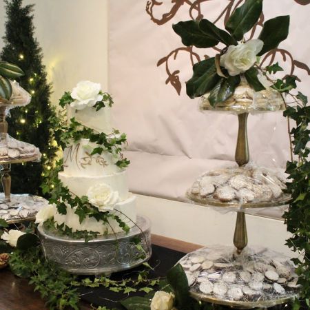 McDonald/Brooks Covenant Wedding McDonald/Brooks Remnant Wedding- White tiered wedding cake with green ivy and white flowers by Remnant Fellowship Cake Committee