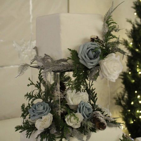 Wedding Cake with clear acrylic layer and blue and white florals made by our Remnant Fellowship Cake Committee