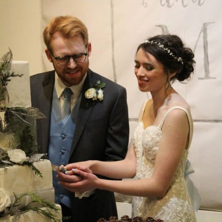 Zinzilieta Covenant Wedding Wedding Cake with clear acrylic layer and blue and white florals made by our Remnant Fellowship Cake Committee