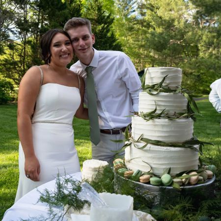 Ottinger/Joaquin Covenant Wedding White Four Tiered Wedding Cake with textured buttercream designs