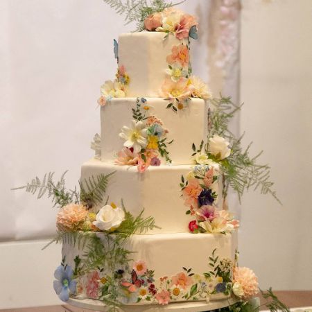Smith/Wheeler Remnant Wedding White Square Tiered Wedding Cake with cascading pastel florals by the Remnant Wedding Cake Committee