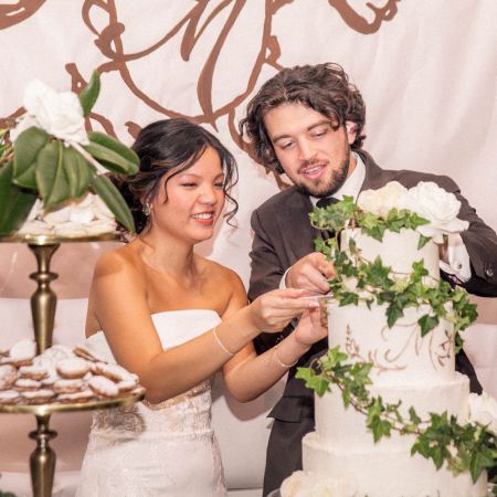 McDonald/Brooks Covenant Wedding McDonald/Brooks Remnant Wedding- White tiered wedding cake with green ivy and white flowers by Remnant Fellowship Cake Committee