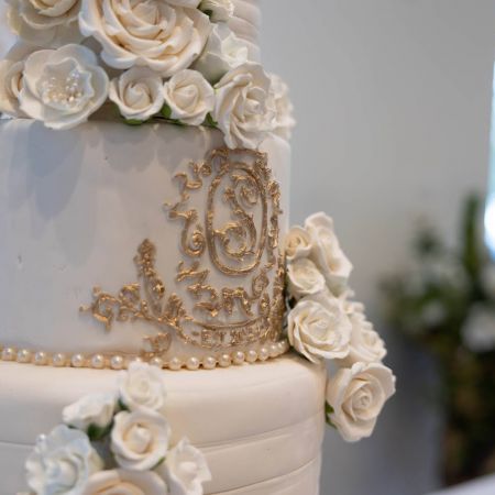 Stites/Shepherd Covenant Wedding Stites/Shepherd Remnant Fellowship Covenant Wedding- White Wedding Cake with Intricate designs, white florals and gold monogram by Remnant Fellowship Cake Committee