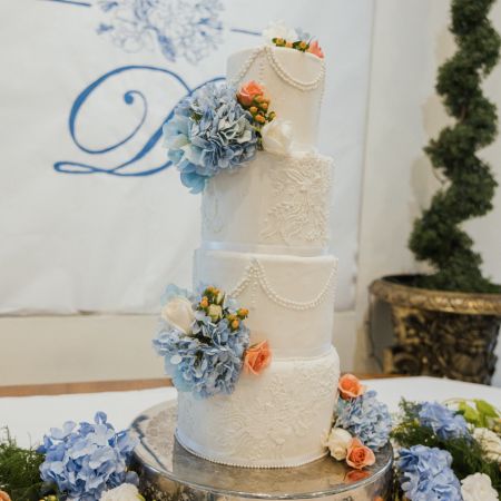 Weaver/Purdy Covenant Wedding Four Tiered White Wedding Cake with Light Blue and Coral accents by the Remnant Fellowship Cake Committee