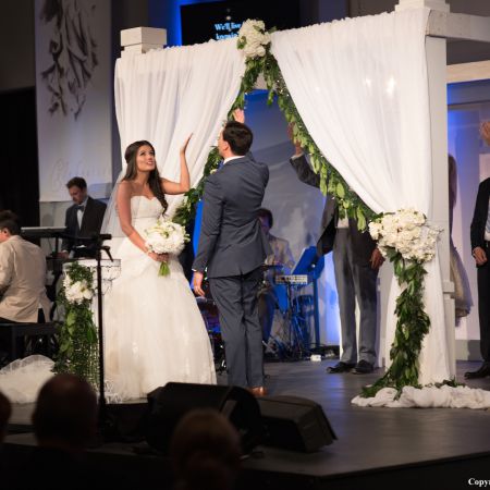 Radebaugh/Betancourt Covenant Wedding Summer Wedding Chuppah | White Draping Linen with Hanging Greenery and White Roses