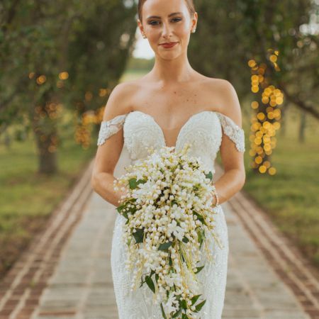 Beautiful White and Green Cascade Boquet by Remnant Fellowship Weddings with Ivy vines and Bellflowers