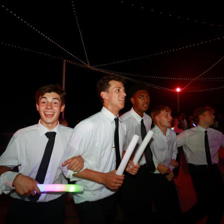 Outdoor summer wedding reception dance party with LED glow up sticks