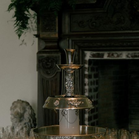 Reception with Fancy Gold Champagne Fountain with Clear and gold cups