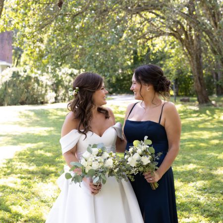 Summer Wedding Navy Blue Bridesmaid dress with a Rose Floral Arrangement