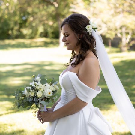 Summer Half-Up-Half-Dwon with white roses and long brunette curls by Remnant Fellowship Hair team