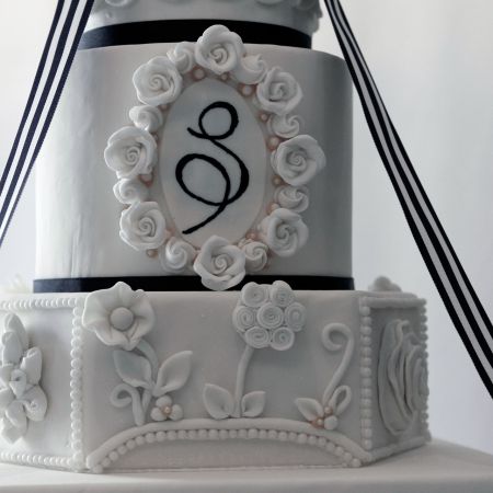 Summer Tiered Wedding Cake with Navy Monogram Accent and Fondant Rosettes