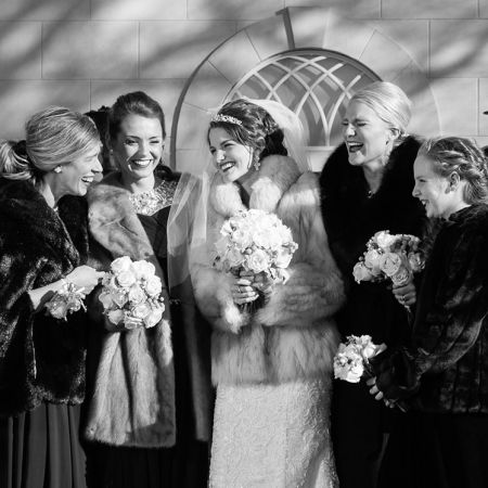 January Winter Wedding Bridal Party Picture | Black Formal Dresses with Fur Coats