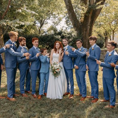 Party of Groomsmen wearing Steal Blue Suits for a Remnant Fellowship Covenant Wedding