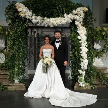 McDonald Covenant Wedding Old-Money Italian-inspired chuppah with stone bases. Airy ivory and draped greenery cascading through classical stone elements. Large white florals with garden roses and peonies.