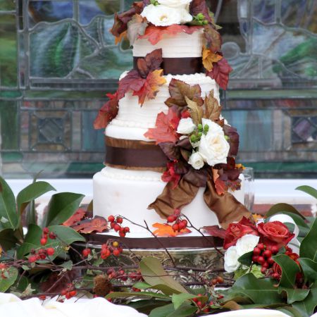 Fall Harvest Rustic Wedding Cake | Round-Tiered with Brown Ribbon and Burnt Orange Leaf Decorations